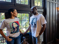 Supporters of Vice President Kamala Harris wear shirts with her image on them at a Get Out the Vote event in Harrisburg, Pennsylvania, Unite...