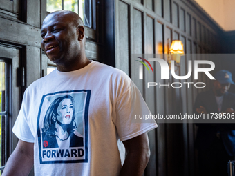 A supporter of Vice President Kamala Harris wears a shirt with her picture on it at a Get Out the Vote event in Harrisburg, Pennsylvania, Un...