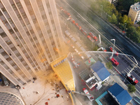 A firefighting and rescue drill for a large commercial complex takes place in Yinchuan, China, on November 1, 2024. (