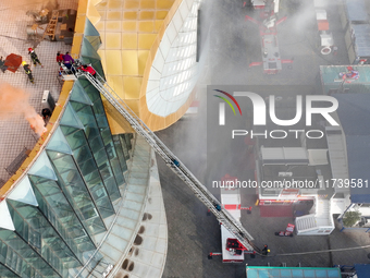 A firefighting and rescue drill for a large commercial complex takes place in Yinchuan, China, on November 1, 2024. (