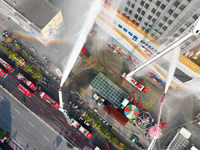 A firefighting and rescue drill for a large commercial complex takes place in Yinchuan, China, on November 1, 2024. (