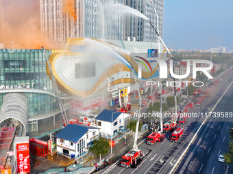 A firefighting and rescue drill for a large commercial complex takes place in Yinchuan, China, on November 1, 2024. (