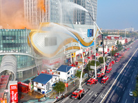 A firefighting and rescue drill for a large commercial complex takes place in Yinchuan, China, on November 1, 2024. (