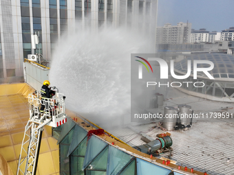 A firefighting and rescue drill for a large commercial complex takes place in Yinchuan, China, on November 1, 2024. (