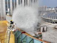 A firefighting and rescue drill for a large commercial complex takes place in Yinchuan, China, on November 1, 2024. (