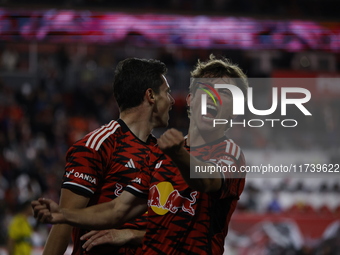 Dante Vainzer celebrates with teammates after scoring a goal at Red Bull Stadium in Harris, New Jersey, on November 3, 2024, where they tie...