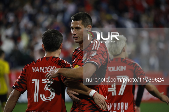 Dante Vainzer celebrates with teammates after scoring a goal at Red Bull Stadium in Harris, New Jersey, on November 3, 2024, where they tie...