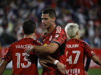 Dante Vainzer celebrates with teammates after scoring a goal at Red Bull Stadium in Harris, New Jersey, on November 3, 2024, where they tie...