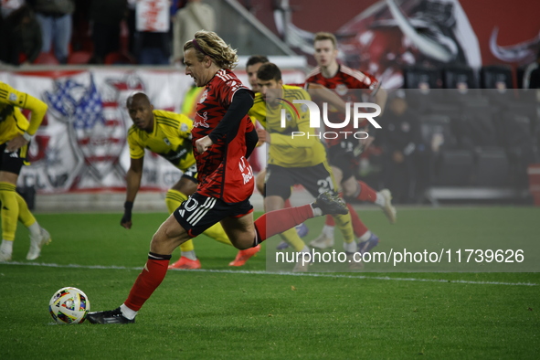 Emil Forsberg scores the penalty kick and celebrates with teammates at Red Bull Stadium in Harris, New Jersey, on November 3, 2024, where th...