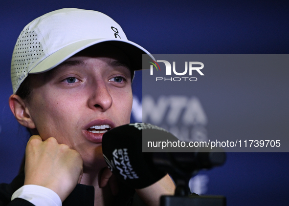 RIYADH, SAUDI ARABIA - NOVEMBER 03: Iga Swiatek of Poland speaks to the media at the post-match press conference after her first tournament...