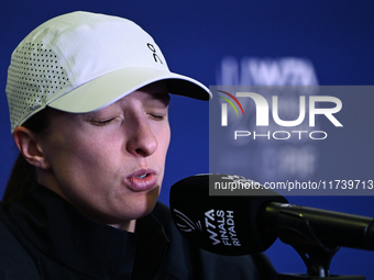 RIYADH, SAUDI ARABIA - NOVEMBER 03: Iga Swiatek of Poland speaks to the media at the post-match press conference after her first tournament...