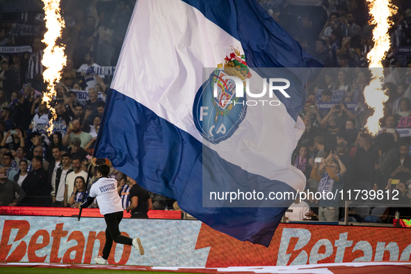 A child holds an FC Porto flag at the Portuguese Premier League soccer match against Estoril at the Estadio do Dragao in Porto, Portugal, on...