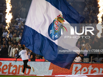 A child holds an FC Porto flag at the Portuguese Premier League soccer match against Estoril at the Estadio do Dragao in Porto, Portugal, on...