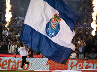 A child holds an FC Porto flag at the Portuguese Premier League soccer match against Estoril at the Estadio do Dragao in Porto, Portugal, on...