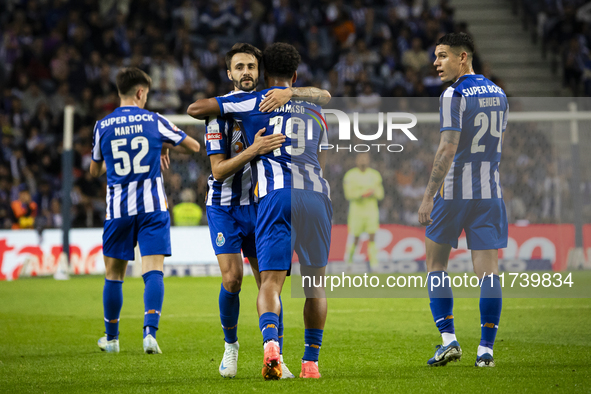 Fabio Vieira and Namaso celebrate after scoring a goal for FC Porto during the Portuguese Primeira Liga soccer match against Estoril at Esta...