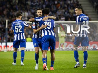 Fabio Vieira and Namaso celebrate after scoring a goal for FC Porto during the Portuguese Primeira Liga soccer match against Estoril at Esta...