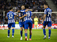 Fabio Vieira and Namaso celebrate after scoring a goal for FC Porto during the Portuguese Primeira Liga soccer match against Estoril at Esta...