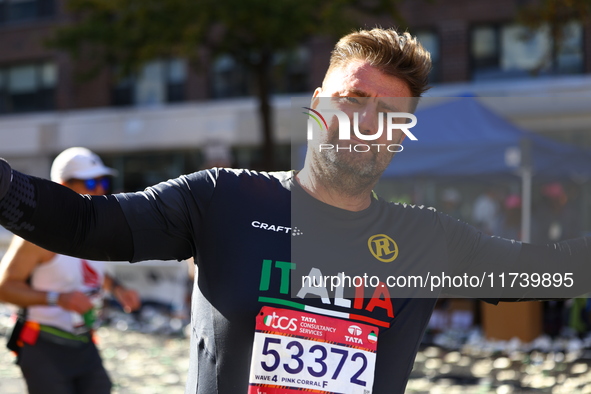 Alan Clusaz of Italy poses for a photo at mile 16 as he heads up First Avenue during the 2024 New York City Marathon in New York, N.Y., on N...