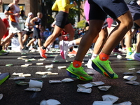 A checkered cab drives Grand Marshall Olympic champion Gabby Thomas up First Avenue during the New York City Marathon in New York City, Unit...