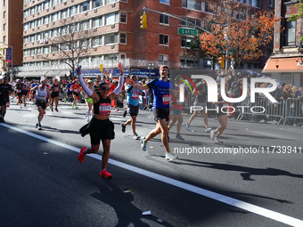 Runners trudge up First Avenue at Mile 16 of the New York City Marathon in New York City, United States, on November 3, 2024. (