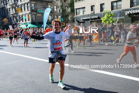 Runners trudge up First Avenue at Mile 16 of the New York City Marathon in New York City, United States, on November 3, 2024. 