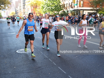 Runners trudge up First Avenue at Mile 16 of the New York City Marathon in New York City, United States, on November 3, 2024. (