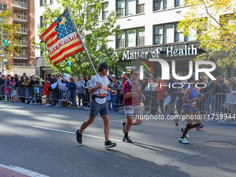 Runners trudge up First Avenue at Mile 16 of the New York City Marathon in New York City, United States, on November 3, 2024. (