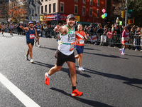 Runners trudge up First Avenue at Mile 16 of the New York City Marathon in New York City, United States, on November 3, 2024. (