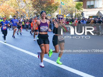 Runners trudge up First Avenue at Mile 16 of the New York City Marathon in New York City, United States, on November 3, 2024. (