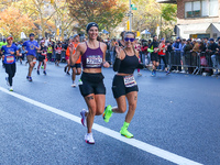 Runners trudge up First Avenue at Mile 16 of the New York City Marathon in New York City, United States, on November 3, 2024. (