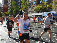 Runners trudge up First Avenue at Mile 16 of the New York City Marathon in New York City, United States, on November 3, 2024. (