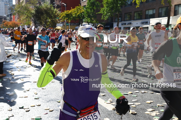 Runners trudge up First Avenue at Mile 16 of the New York City Marathon in New York City, United States, on November 3, 2024. 