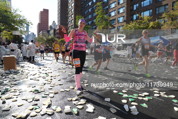 Runners trudge up First Avenue at Mile 16 of the New York City Marathon in New York City, United States, on November 3, 2024. 