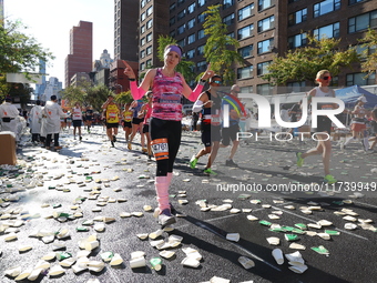 Runners trudge up First Avenue at Mile 16 of the New York City Marathon in New York City, United States, on November 3, 2024. (