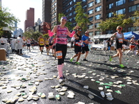 Runners trudge up First Avenue at Mile 16 of the New York City Marathon in New York City, United States, on November 3, 2024. (