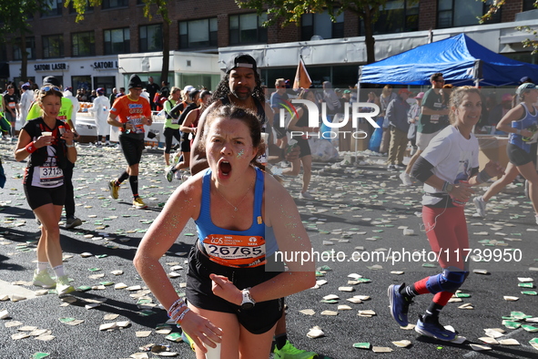 Runners trudge up First Avenue at Mile 16 of the New York City Marathon in New York City, United States, on November 3, 2024. 