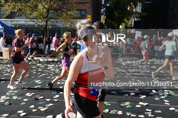 Runners trudge up First Avenue at Mile 16 of the New York City Marathon in New York City, United States, on November 3, 2024. 