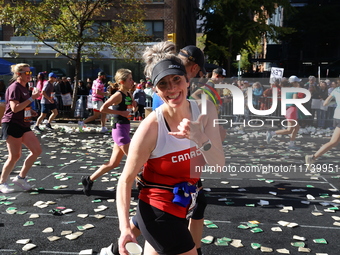 Runners trudge up First Avenue at Mile 16 of the New York City Marathon in New York City, United States, on November 3, 2024. (