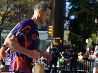 Runners trudge up First Avenue at Mile 16 of the New York City Marathon in New York City, United States, on November 3, 2024. (