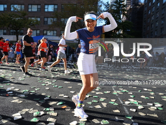 Runners trudge up First Avenue at Mile 16 of the New York City Marathon in New York City, United States, on November 3, 2024. (