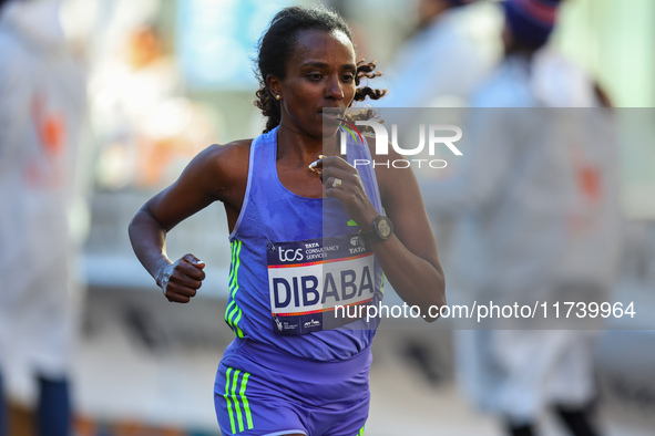 Marathoner Tirunesh Dibaba of Ethiopia races up First Avenue during the 2024 New York City Marathon in New York, N.Y., on November 3, 2024. 