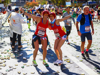 Runners Michelle Douglas and Michelle Richards of the United States pose for a photo as they head up First Avenue during the 2024 New York C...