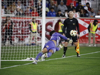 New York Red Bulls goalkeeper Carlos Coronel makes a penalty kick save to eliminate the defending MLS Cup champion Columbus Crew in Harris,...