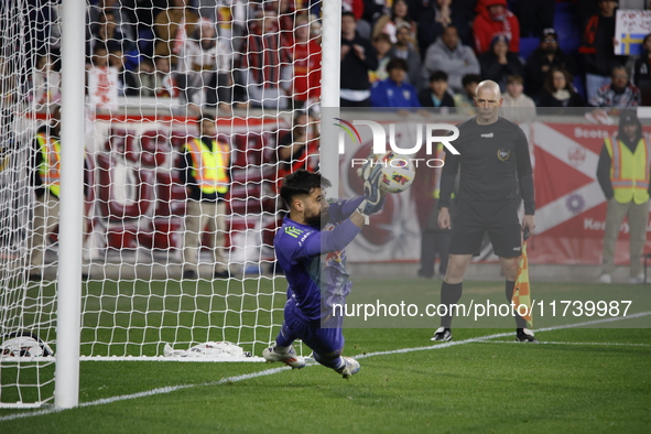 New York Red Bulls goalkeeper Carlos Coronel makes a penalty kick save to eliminate the defending MLS Cup champion Columbus Crew in Harris,...