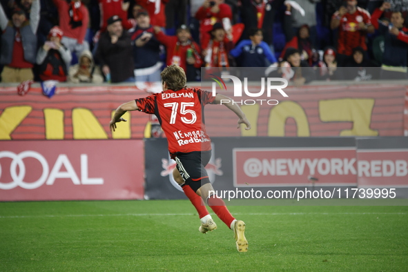 New York Red Bulls midfielder Daniel Edelia (75) celebrates the penalty kick goal that gives them a shootout victory over the Columbus Crew...