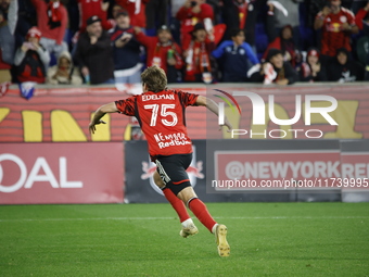 New York Red Bulls midfielder Daniel Edelia (75) celebrates the penalty kick goal that gives them a shootout victory over the Columbus Crew...