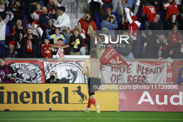 New York Red Bulls midfielder Daniel Edelia (75) celebrates the penalty kick goal that gives them a shootout victory over the Columbus Crew...