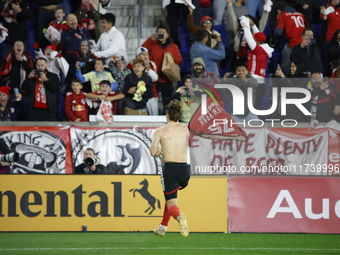 New York Red Bulls midfielder Daniel Edelia (75) celebrates the penalty kick goal that gives them a shootout victory over the Columbus Crew...