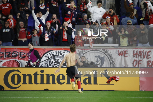 New York Red Bulls midfielder Daniel Edelia (75) celebrates the penalty kick goal that gives them a shootout victory over the Columbus Crew...