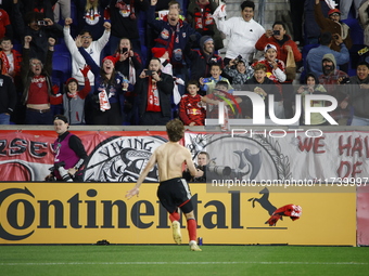 New York Red Bulls midfielder Daniel Edelia (75) celebrates the penalty kick goal that gives them a shootout victory over the Columbus Crew...